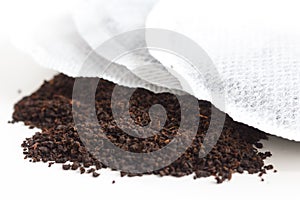 Round teabag on tea leaves.