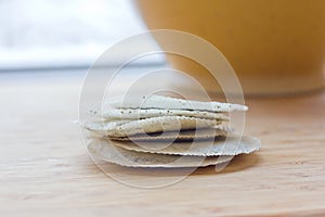 Round teabags on counter top. Closeup. photo