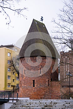 Round tower in the historic surrounding city wall of Slupsk, Poland. Witches tower - Baszta Czarownic. Sights of Poland photo