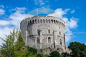 Round Tower with a raised flag in Windsor Castle, England