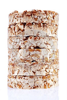 Round wheat crispbread, white background. Composition of crispbread on white background.