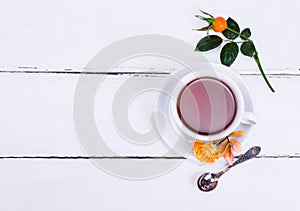 Round white cup and saucer inside hot black tea