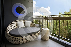 Round white gray fabric sofa at bacony in modern style