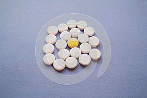 Round white pills and yellow one