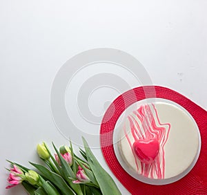 Round whole strawberry cake dessert with tulips flowers. Fresh Birthday Cake.  on white. Room for text. Clipping Path. Val