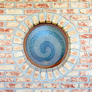 Round window on brick wall