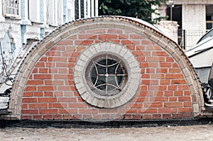 Round window with grille