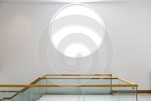 Round window on a white wall building