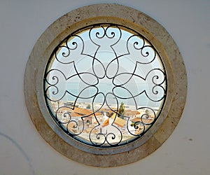 Round windows with harbor view in lissabon photo