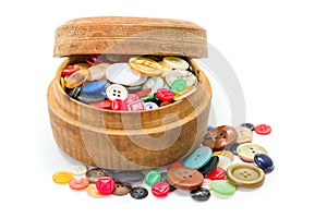 Round wooden box with colorful buttons