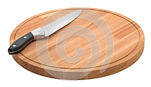 Round wooden cutting board and metal knife on a white background