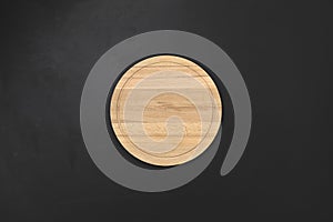 Round wooden tray or cutting board on table. Top view