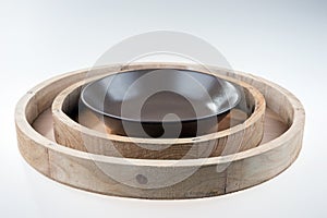 Round wooden tray on white background