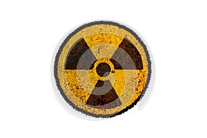 Round yellow and black radioactive ionizing radiation nuclear danger symbol on rusty metal grungy texture