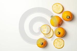 Round zucchini and slices on white background, top view