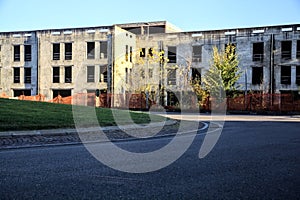 Roundabout with an abandoned building in the background at sunset