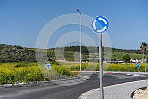 Roundabout Directional Traffic Sign. Circular Traffic Sign With Spring Landscape.