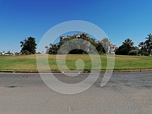 Roundabout with green grass in Isla Canela province of Huelva Spain, Andalusia