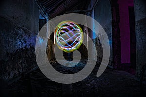 Rounded figure in an abandoned house. Lightpainting photography