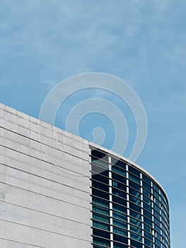 Rounded lines of modern architecture building in Madrid Spain vertical photo