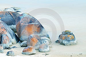 Rounded red rocks in Wilsons Promontory - Squeaky Beach