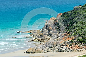 Rounded red rocks in Wilsons Promontory - Squeaky Beach