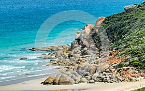 Rounded red rocks in Wilsons Promontory - Squeaky Beach