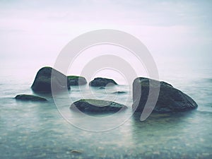 Rounded stone and pebble stones on the sea beach