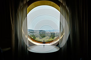 Rounded window in a hotel room