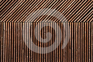 Rounded wooden slats forming modern pattern as wall design background