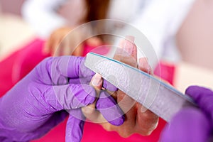 Rounding the shape of a nail with nail file