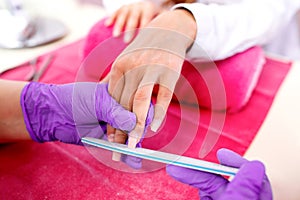 Rounding the shape of a nail with nail file