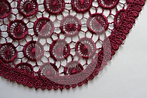 Roundish edge of dark red lace