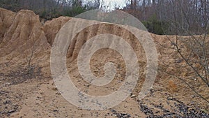 roundup on a deep gully in a slope of red clay