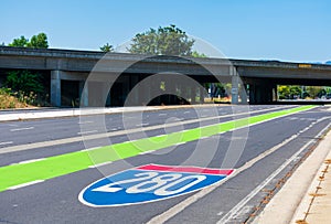 Route 280 shield pavement marking in shape of familiar route shields guide travelers safely through unfamiliar interchange. Green