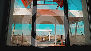 Route 66. crisis road 66 fueling broken window slow motion video. Old dirty deserted gas station. U.S. closed