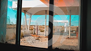 Route 66. crisis road 66 fueling broken window slow motion video. Old dirty lifestyle deserted gas station. U.S. closed