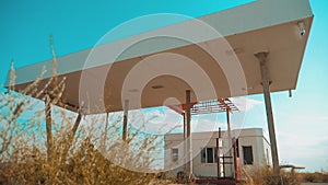 Route 66. crisis road 66 fueling slow motion video. Old dirty deserted gas station. U.S. closed supermarket store shop