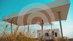 Route 66. crisis road 66 fueling slow motion video. Old dirty deserted gas station. U.S. closed supermarket store shop