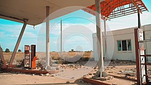 Route 66. crisis road 66 fueling slow motion video. Old dirty deserted gas station. U.S. closed supermarket store shop