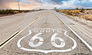 Route 66 road sign with blue sky background. Classic concept for travel and adventure in a vintage way