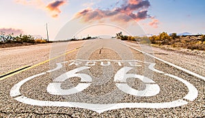 Route 66 road sign with blue sky background. Classic concept for travel and adventure in a vintage way