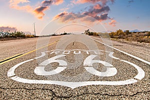 Route 66 road sign with blue sky background. Classic concept for travel and adventure in a vintage way