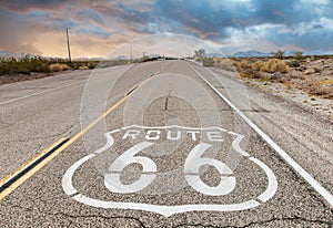 Route 66 road sign with blue sky background. Classic concept for travel and adventure in a vintage way