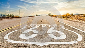 Route 66 road sign with blue sky background. Classic concept for travel and adventure in a vintage way