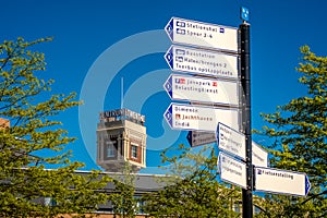 Route signs and a former steam mill tower in Almelo