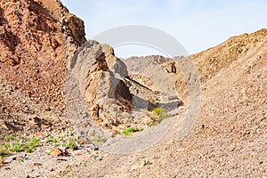 The route or walking path, track through the yellow red rocky landscapes of Eilat desert