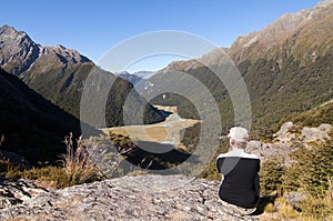 Routeburn Track - Tramper overlooking Routeburn Fl photo