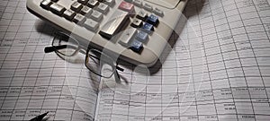 Financial  Analysis table with calculator and glasses. photo