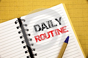 Daily Routine. Business concept for Habitual Lifestyle written on notepad with copy space on old wood wooden background with pen m